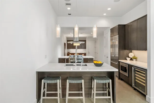 a kitchen with granite countertop a sink and stove