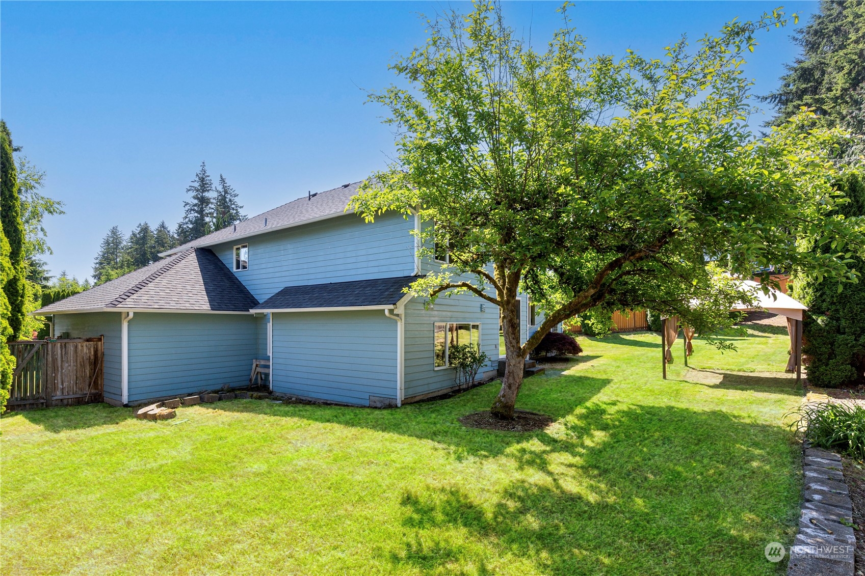 3824 Maple Road Lynnwood, WA 98037 - Photo 4 of 4 a front view of a house with a garden