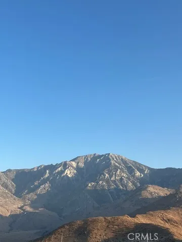a view of mountain with sunset