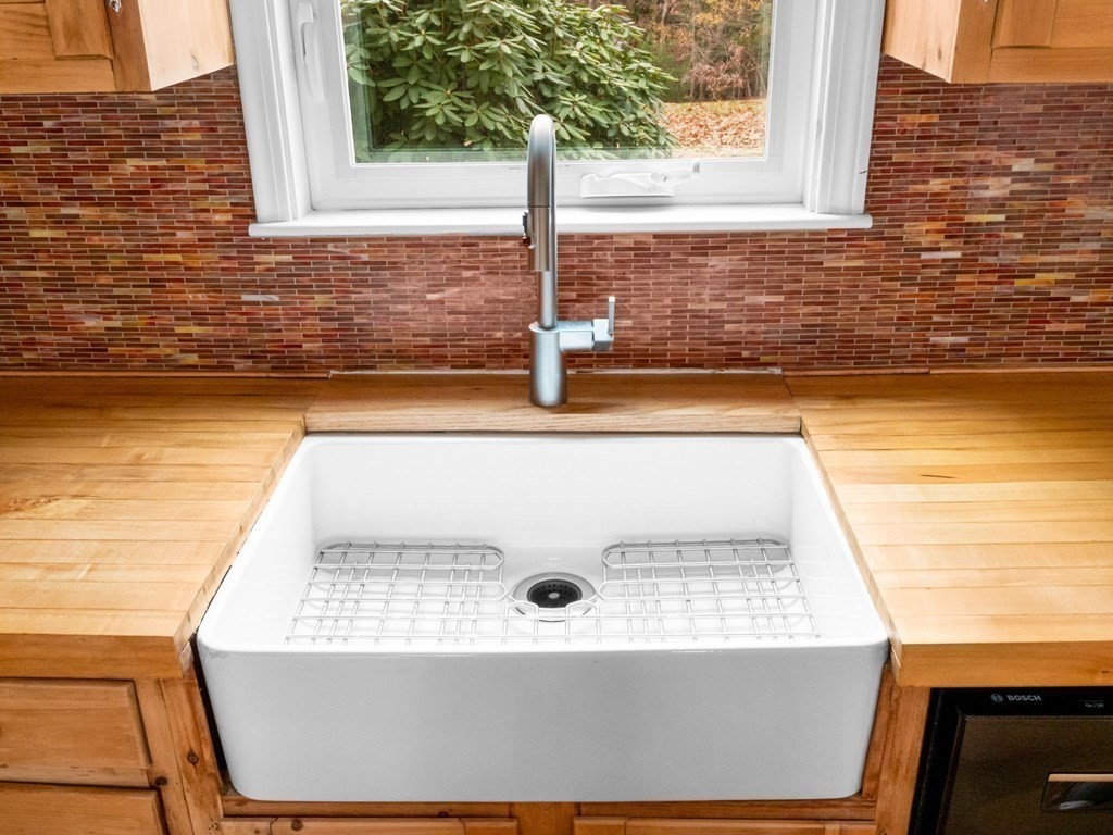 775 Shore Road Bourne, MA 02559 - Photo 12 of 42 a view of a sink a window and a kitchen