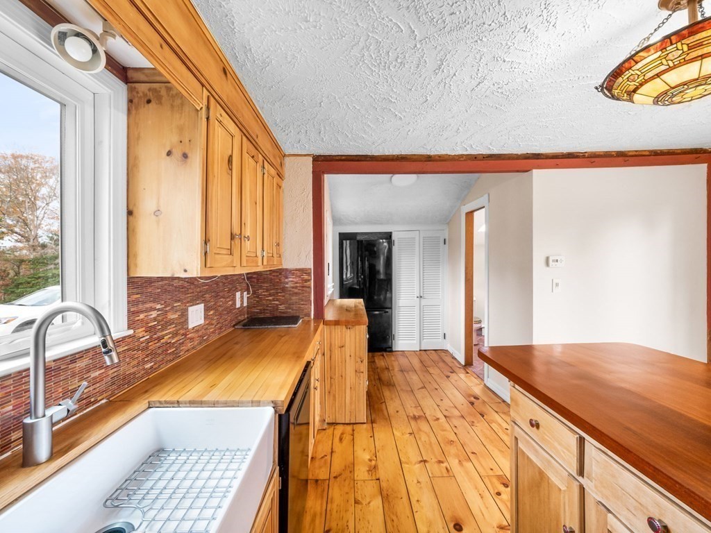 775 Shore Road Bourne, MA 02559 - Photo 14 of 42 a view of a bathroom with a tub and large windows