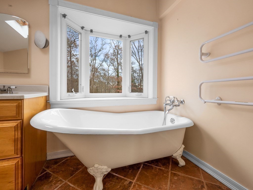 775 Shore Road Bourne, MA 02559 - Photo 16 of 42 a white bath tub sitting next to a white sink