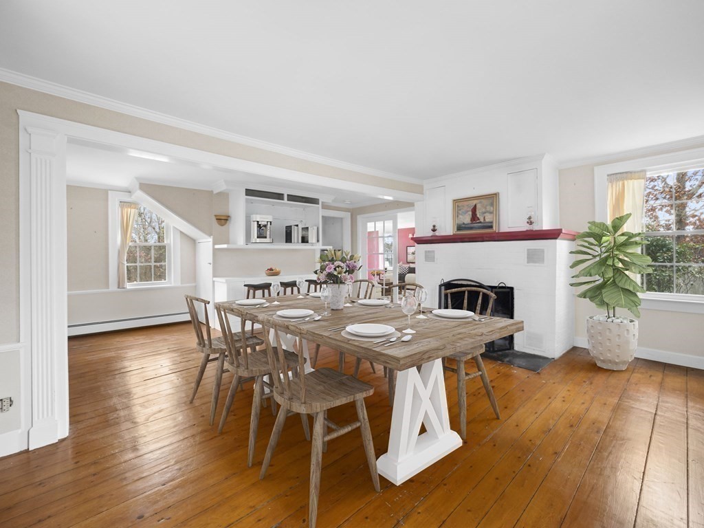775 Shore Road Bourne, MA 02559 - Photo 21 of 42 a view of a dining room with furniture and wooden floor