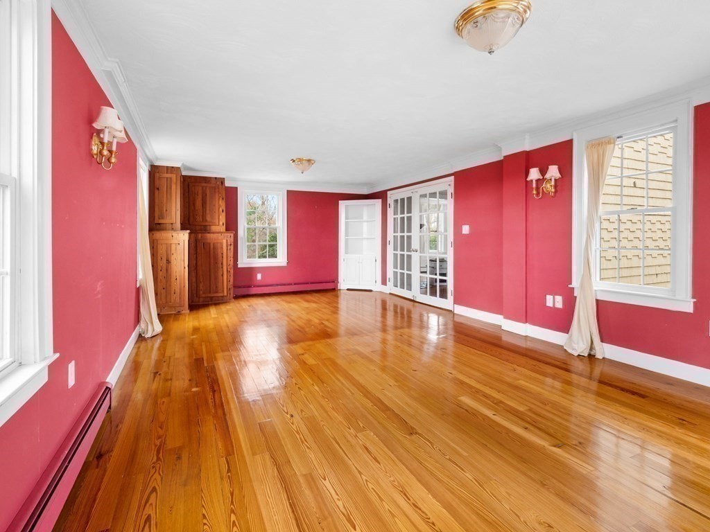 775 Shore Road Bourne, MA 02559 - Photo 25 of 42 a view of an empty room with a window and wooden floor