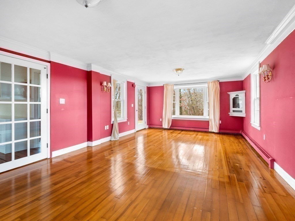 775 Shore Road Bourne, MA 02559 - Photo 28 of 42 a view of an empty room with window and wooden floor