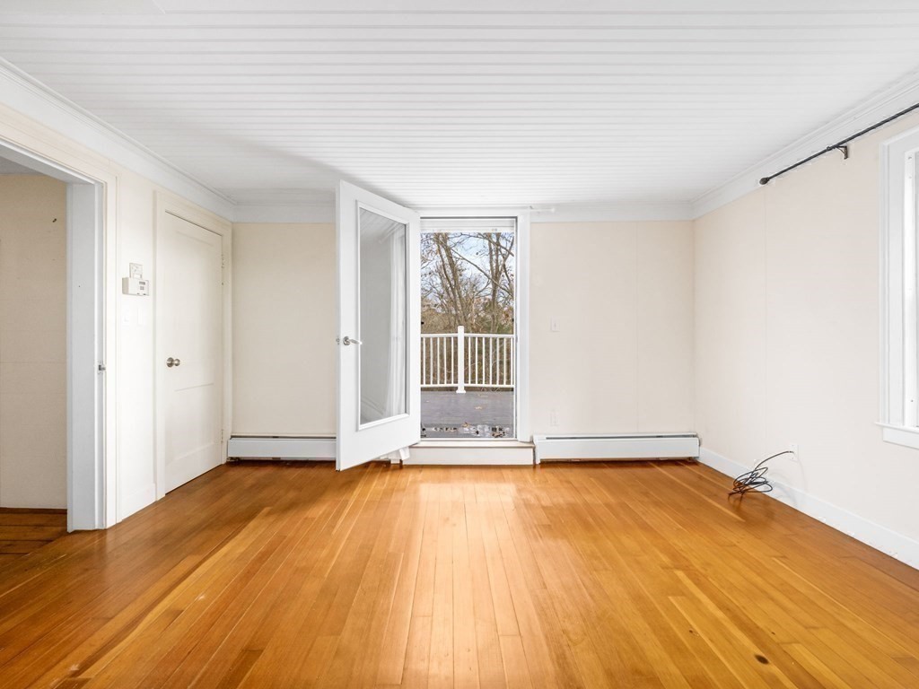 775 Shore Road Bourne, MA 02559 - Photo 36 of 42 a view of an empty room with wooden floor and a window