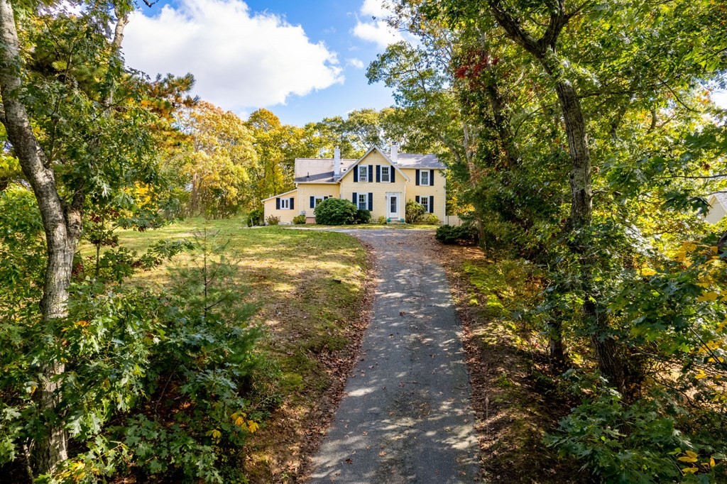 775 Shore Road Bourne, MA 02559 - Photo 42 of 42 a front view of a house with a yard