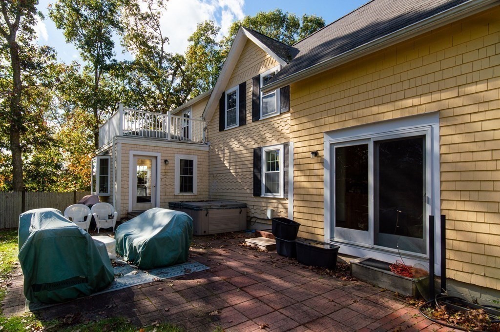 775 Shore Road Bourne, MA 02559 - Photo 5 of 42 a view of a house with a patio