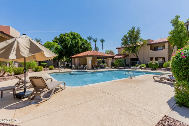a front view of house with yard and outdoor seating