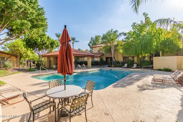 a view of a swimming pool with a patio