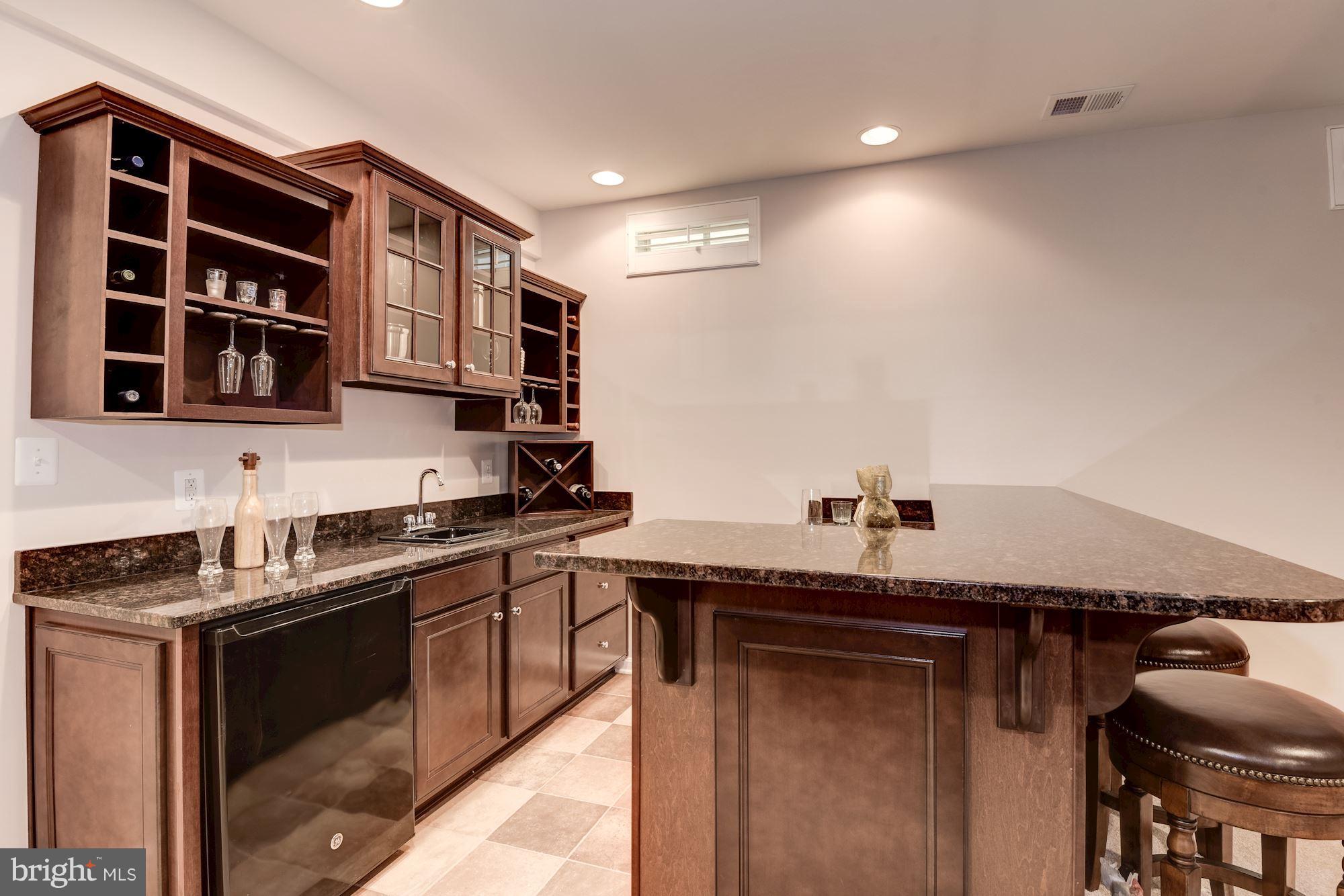6015 Masondale Road Alexandria, VA 22315 - Photo 25 of 30 Wet Bar in the Rec Room-Granite, Glass Front Cabs