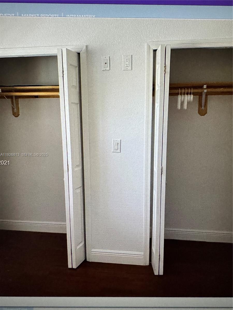 7130 Northwest 179th Street, Unit 108 Hialeah, FL 33015 - Photo 9 of 11 a view of walk in closet