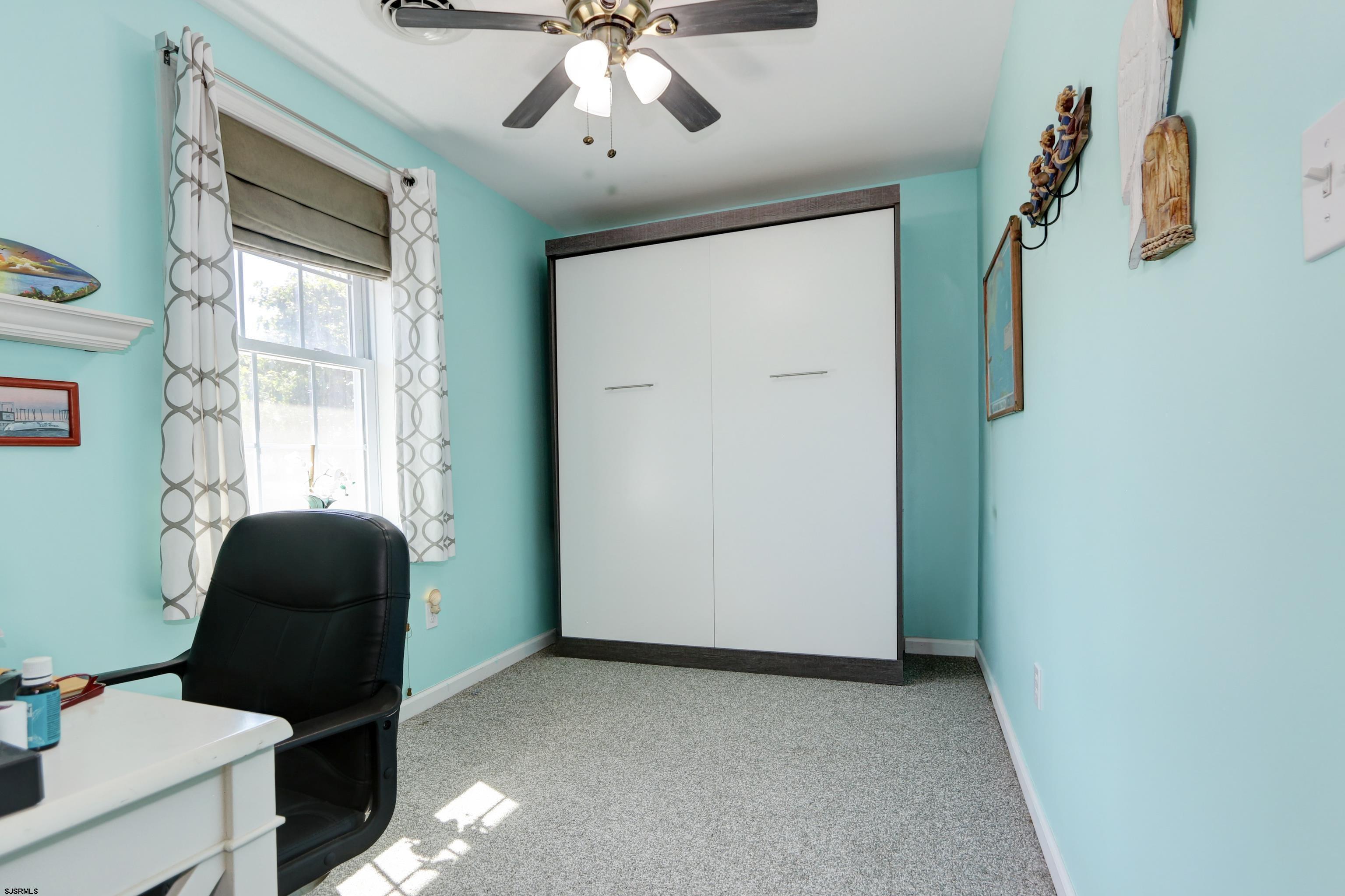 34 North Shore Road Marmora, NJ 08223 - Photo 12 of 37 a living room with furniture and a window