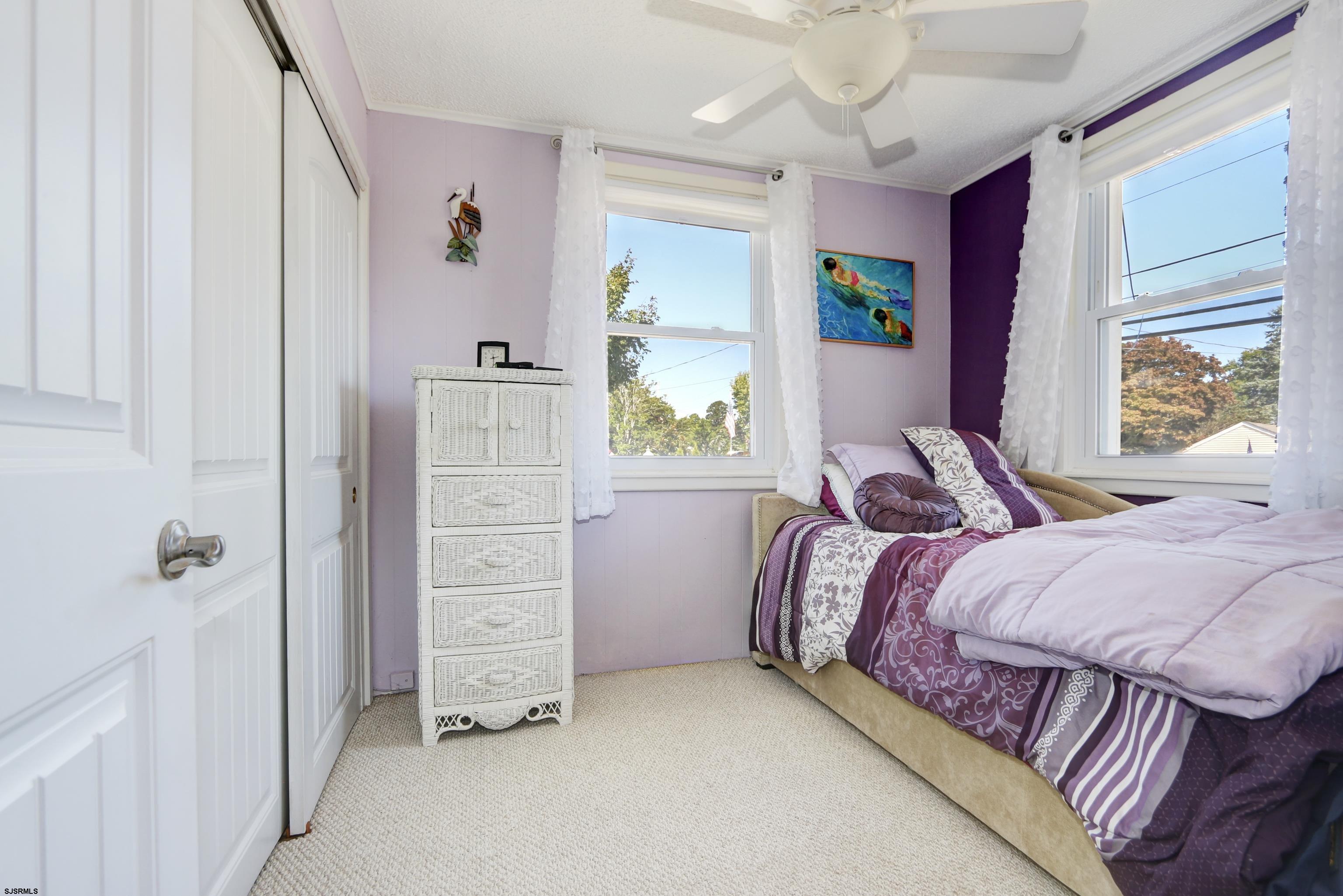 34 North Shore Road Marmora, NJ 08223 - Photo 13 of 37 a bedroom with a bed and a window