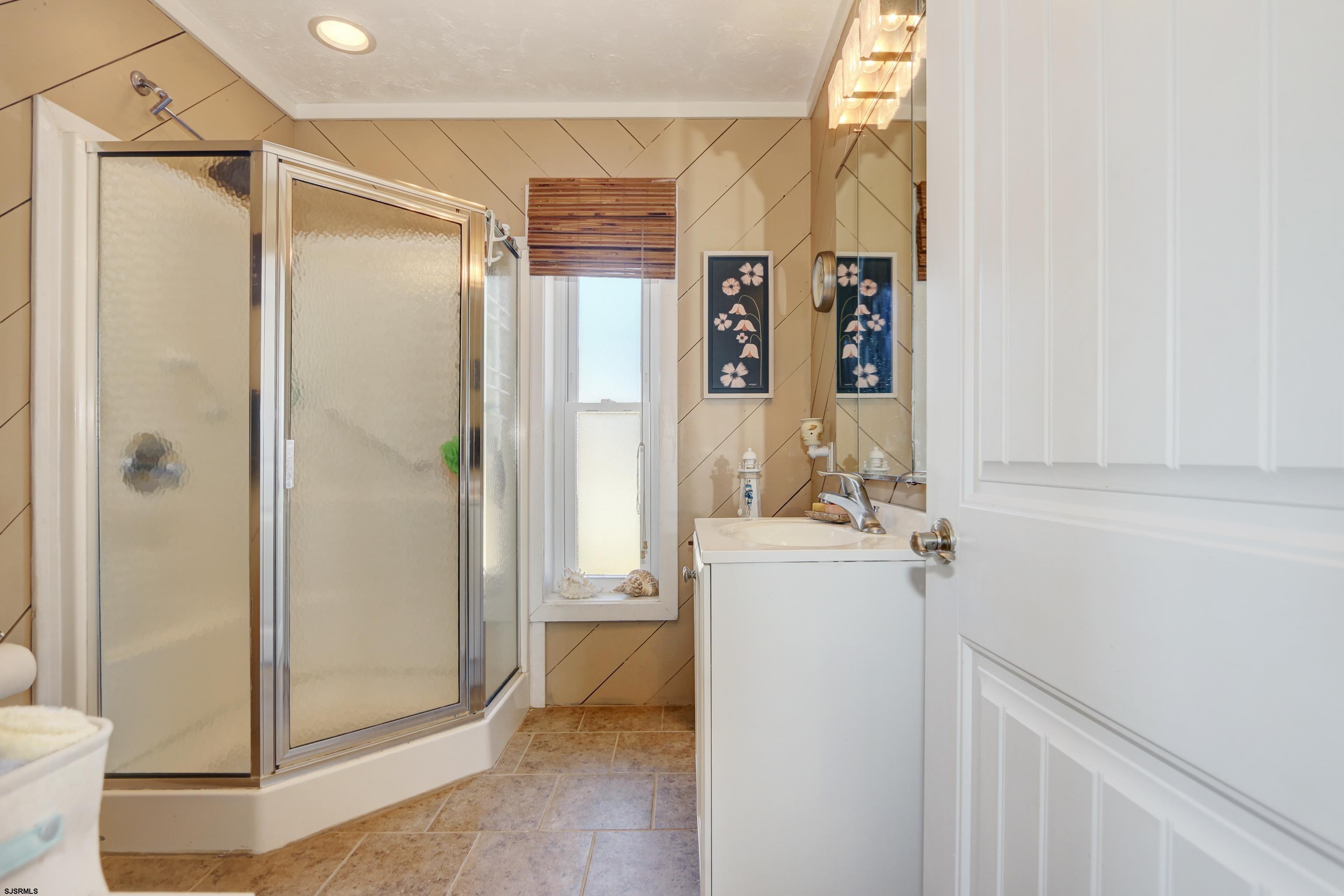 34 North Shore Road Marmora, NJ 08223 - Photo 17 of 37 a bathroom with a shower and a sink