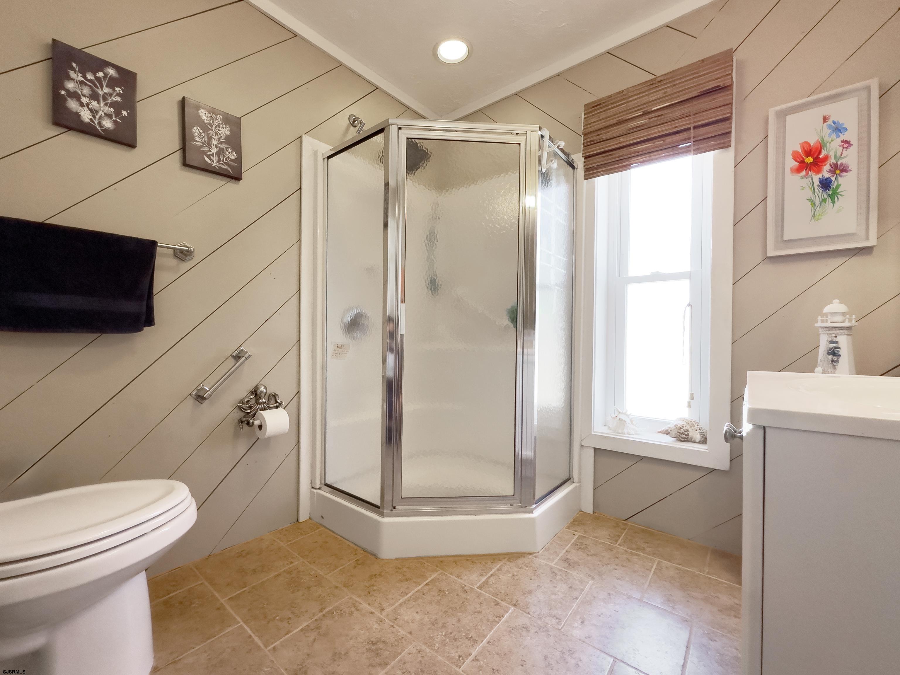 34 North Shore Road Marmora, NJ 08223 - Photo 18 of 37 a bathroom with a shower a toilet and a shower