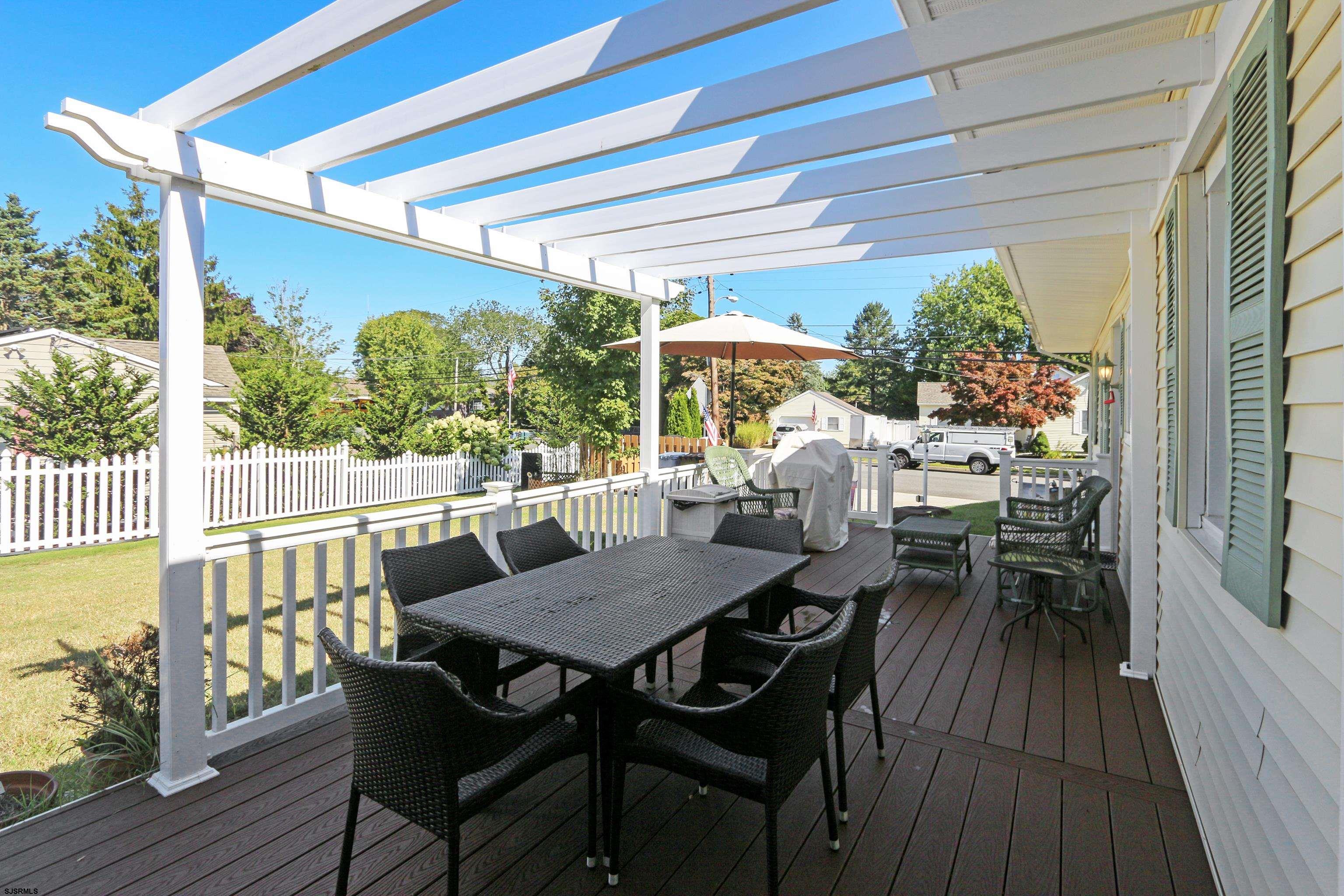 34 North Shore Road Marmora, NJ 08223 - Photo 24 of 37 a view of a patio with a table chairs and a table