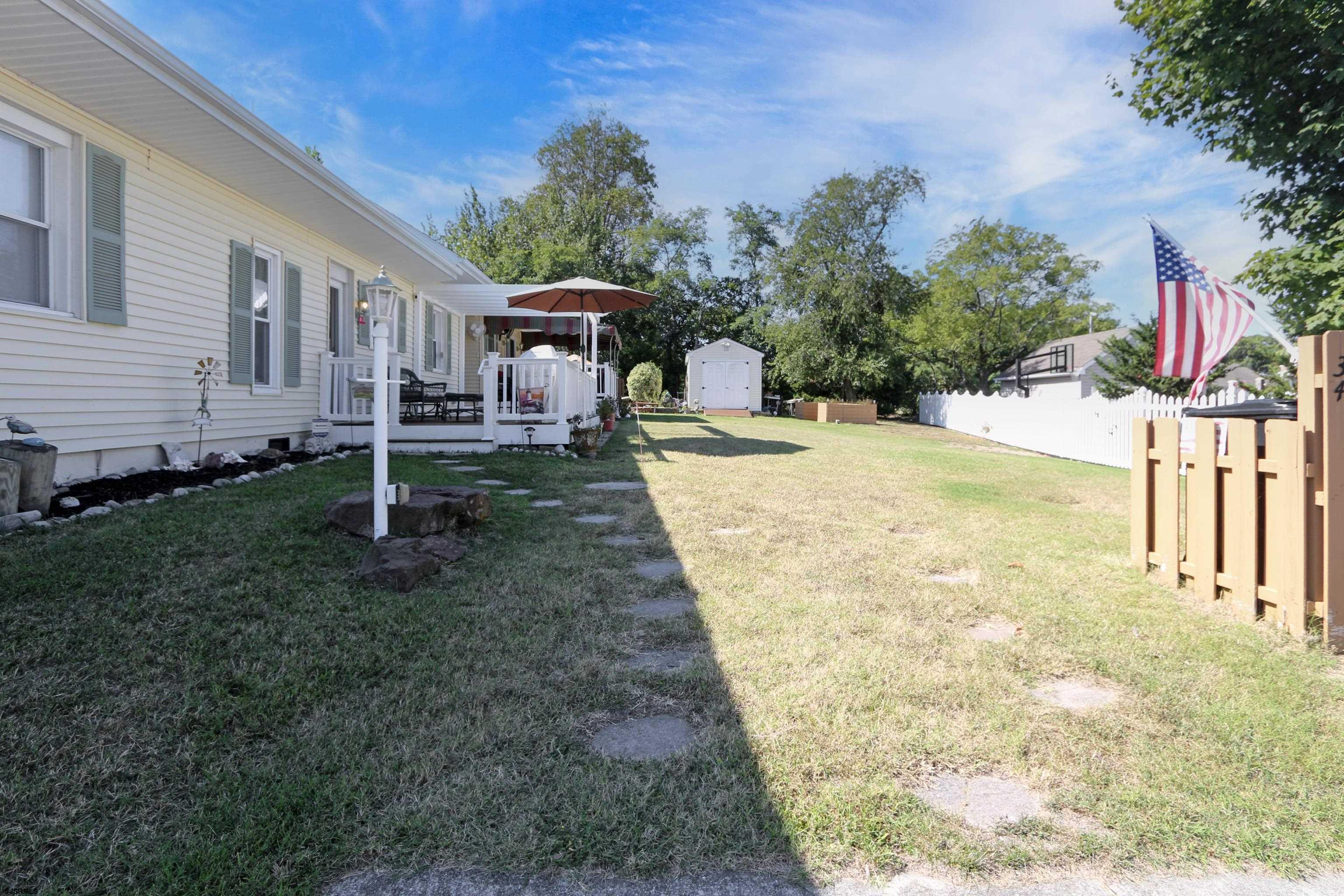 34 North Shore Road Marmora, NJ 08223 - Photo 29 of 37 a view of a house with backyard and sitting area
