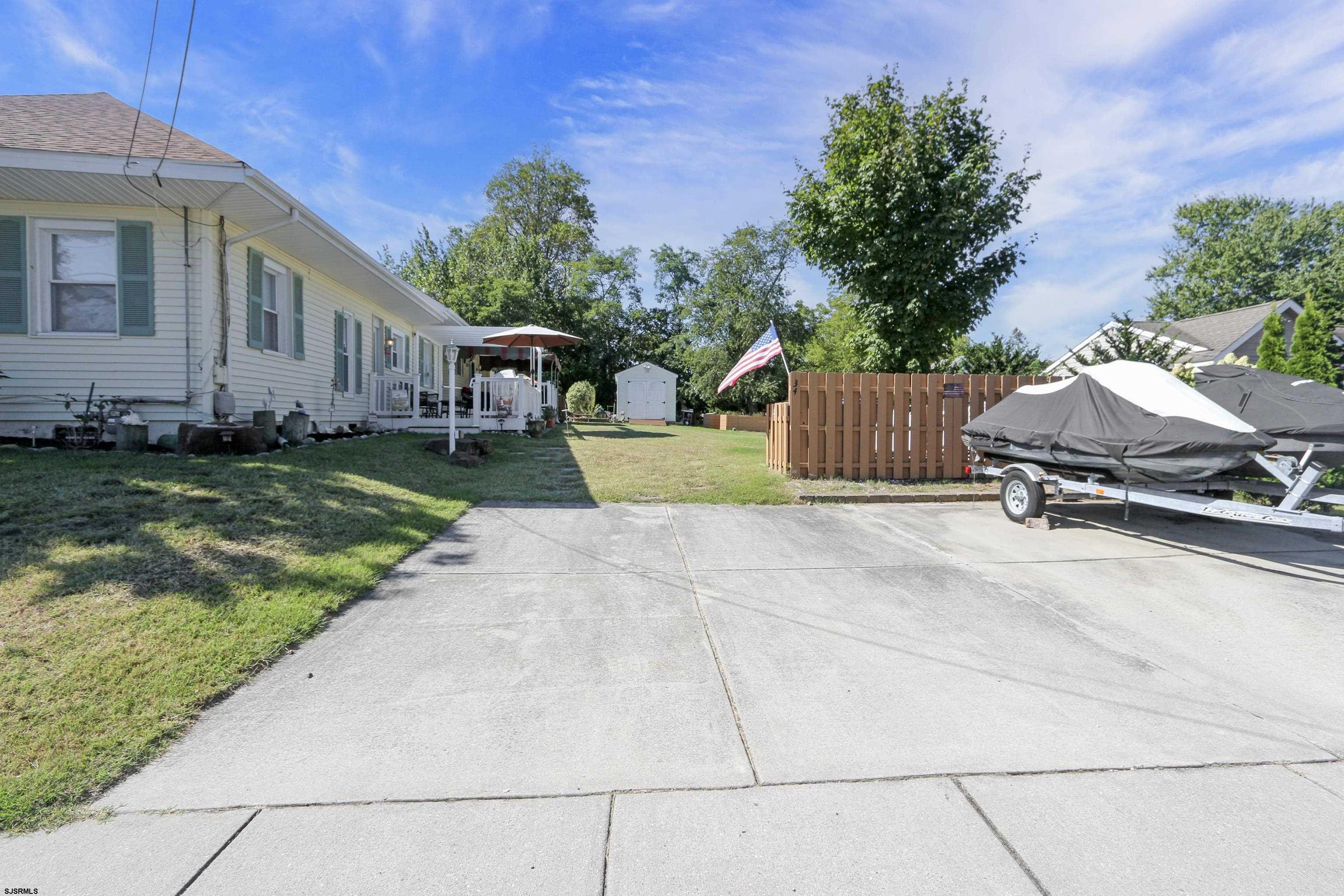 34 North Shore Road Marmora, NJ 08223 - Photo 30 of 37 a view of a house with backyard and sitting area