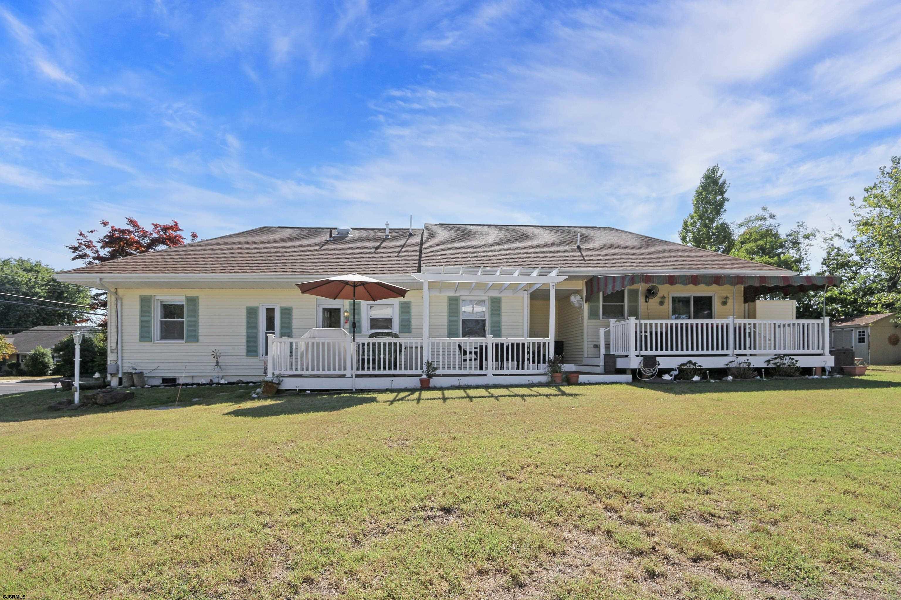 34 North Shore Road Marmora, NJ 08223 - Photo 32 of 37 a front view of a house with swimming pool and next to a yard