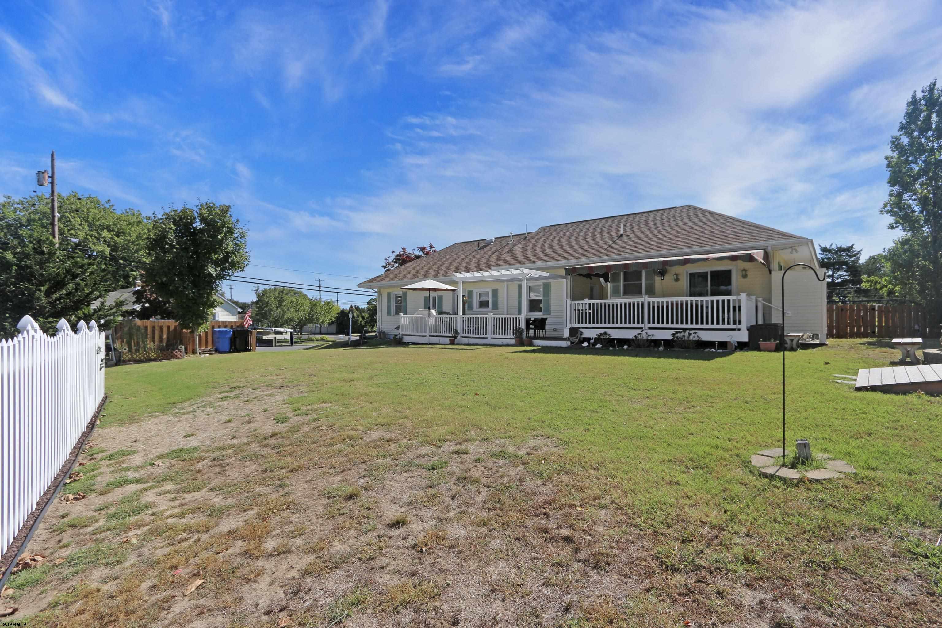 34 North Shore Road Marmora, NJ 08223 - Photo 33 of 37 a front view of a house with a yard