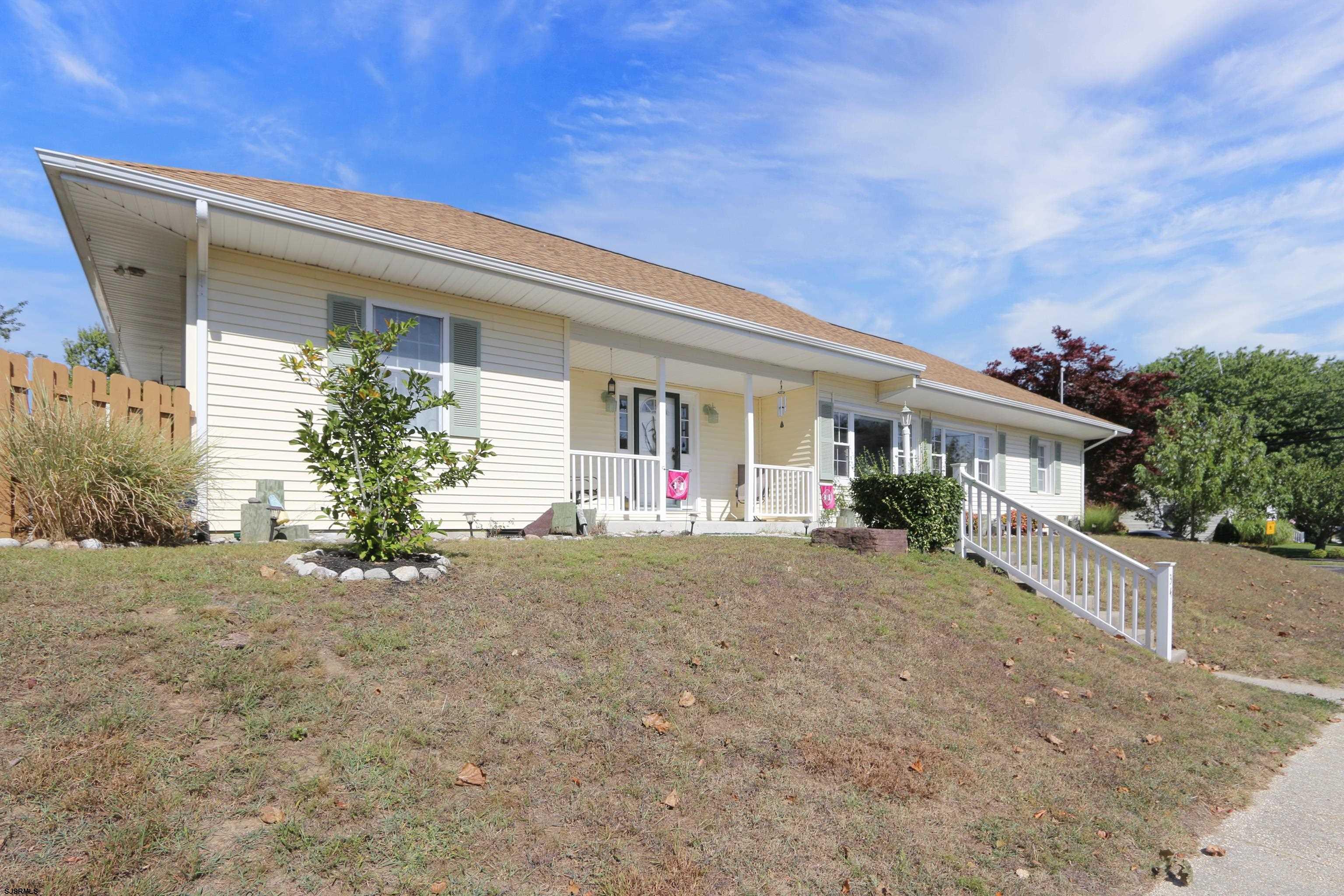 34 North Shore Road Marmora, NJ 08223 - Photo 34 of 37 front view of house with a yard