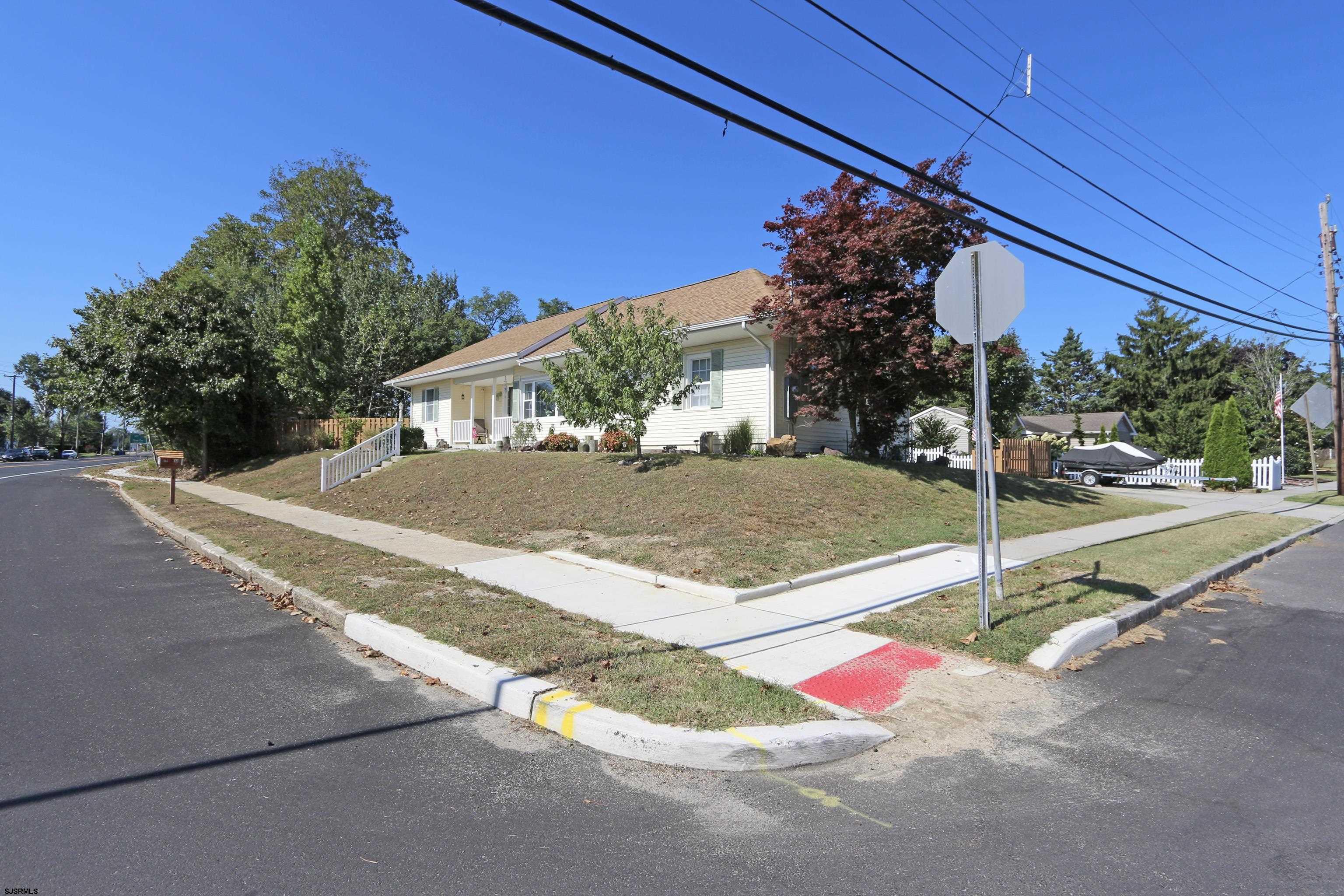 34 North Shore Road Marmora, NJ 08223 - Photo 35 of 37 a view of a house with backyard and a street view