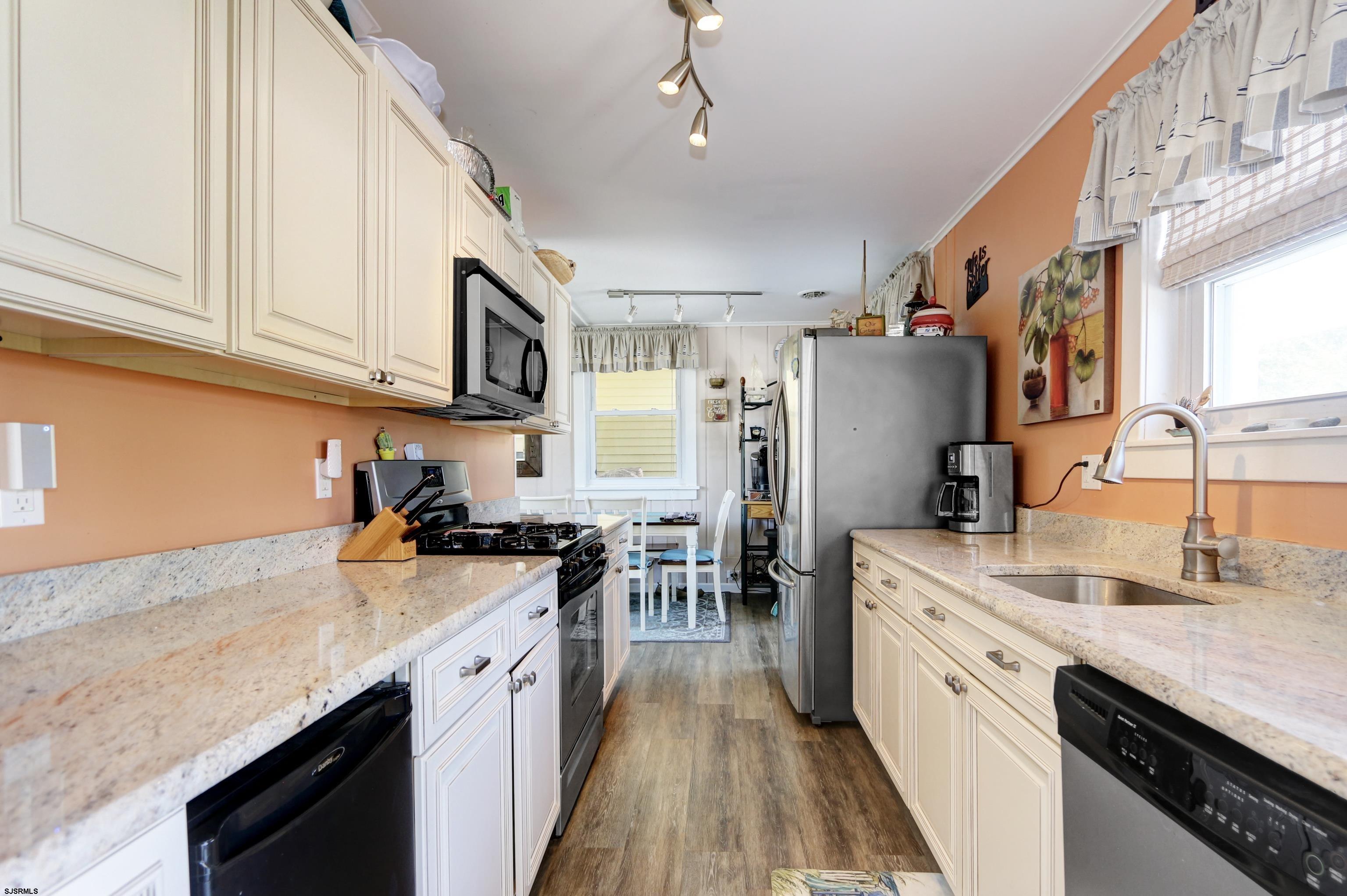 34 North Shore Road Marmora, NJ 08223 - Photo 10 of 37 a kitchen with a sink stove and refrigerator