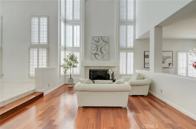 a view of a room with furniture and chandelier