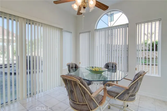 a view of a room with wooden floor and windows