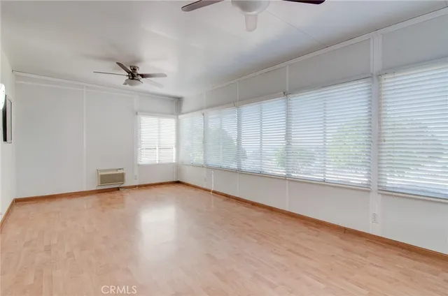 a bedroom with a bed dresser and a window