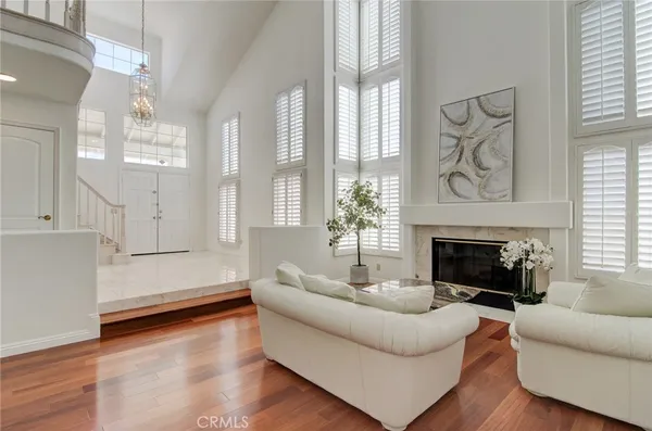 a view of a dining room with furniture and chandelier