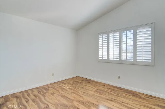 a spacious bathroom with a double vanity sink large mirror and a bathtub