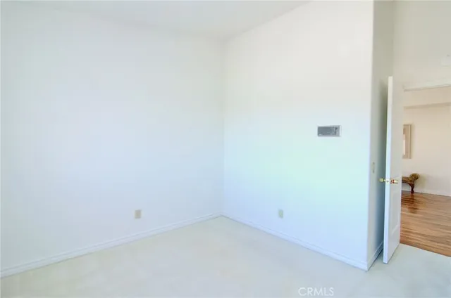 a view of a terrace with yard and mountain view in back
