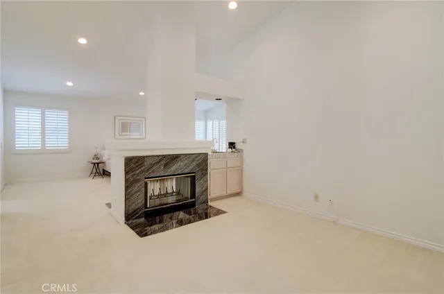 a view of a green field with wooden fence