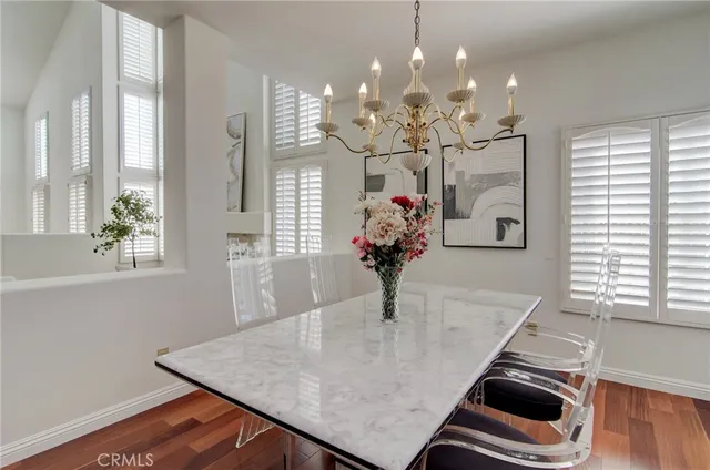 a large kitchen with stainless steel appliances kitchen island granite countertop a sink and cabinets