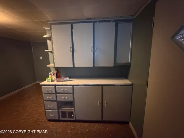 a bathroom with a sink a mirror and a shower