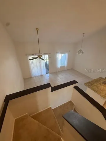 a kitchen with granite countertop a sink a stove and a wooden floor