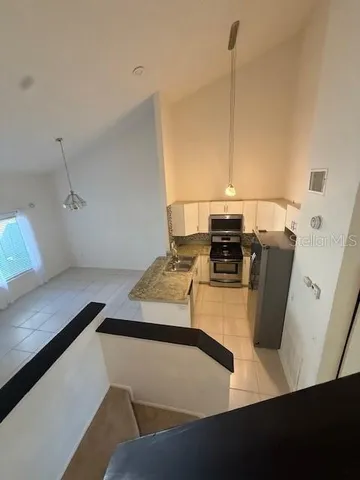 a view of a living room with furniture