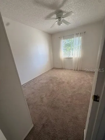 en empty room with windows and closet