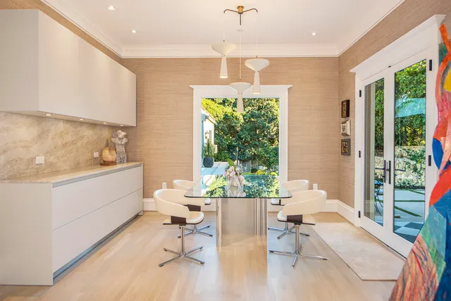 a view of a house with a wooden fence