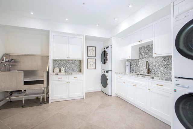 a view of a patio with couches and a potted plant on a table