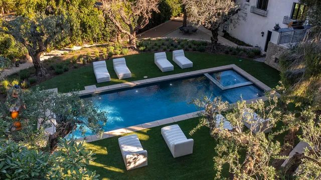 a view of a yard with large trees