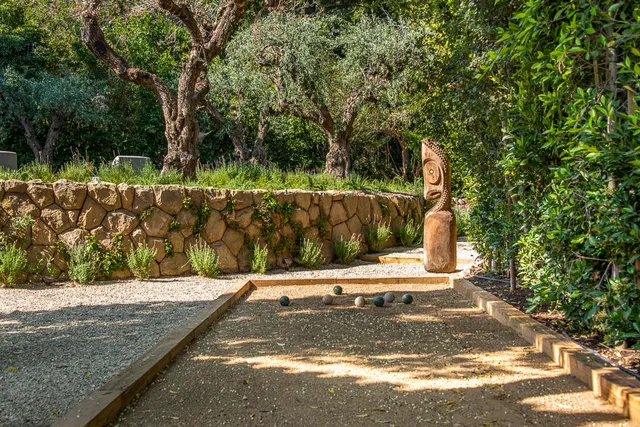 an aerial view of a house with a yard and garden