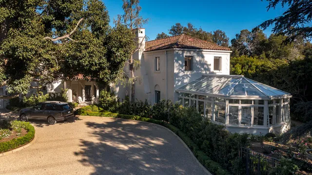 a view of house with yard and green space
