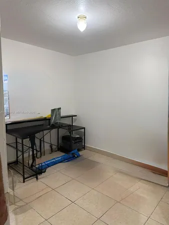 a kitchen with cabinets and stainless steel appliances