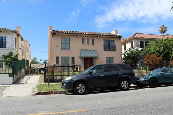 a view of a car parked in front of a house