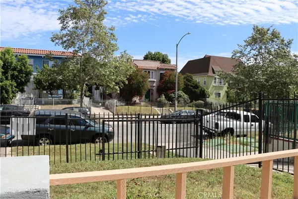 a view of a house with a fence