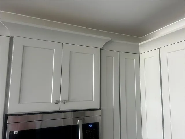 a view of hallway with wooden floor