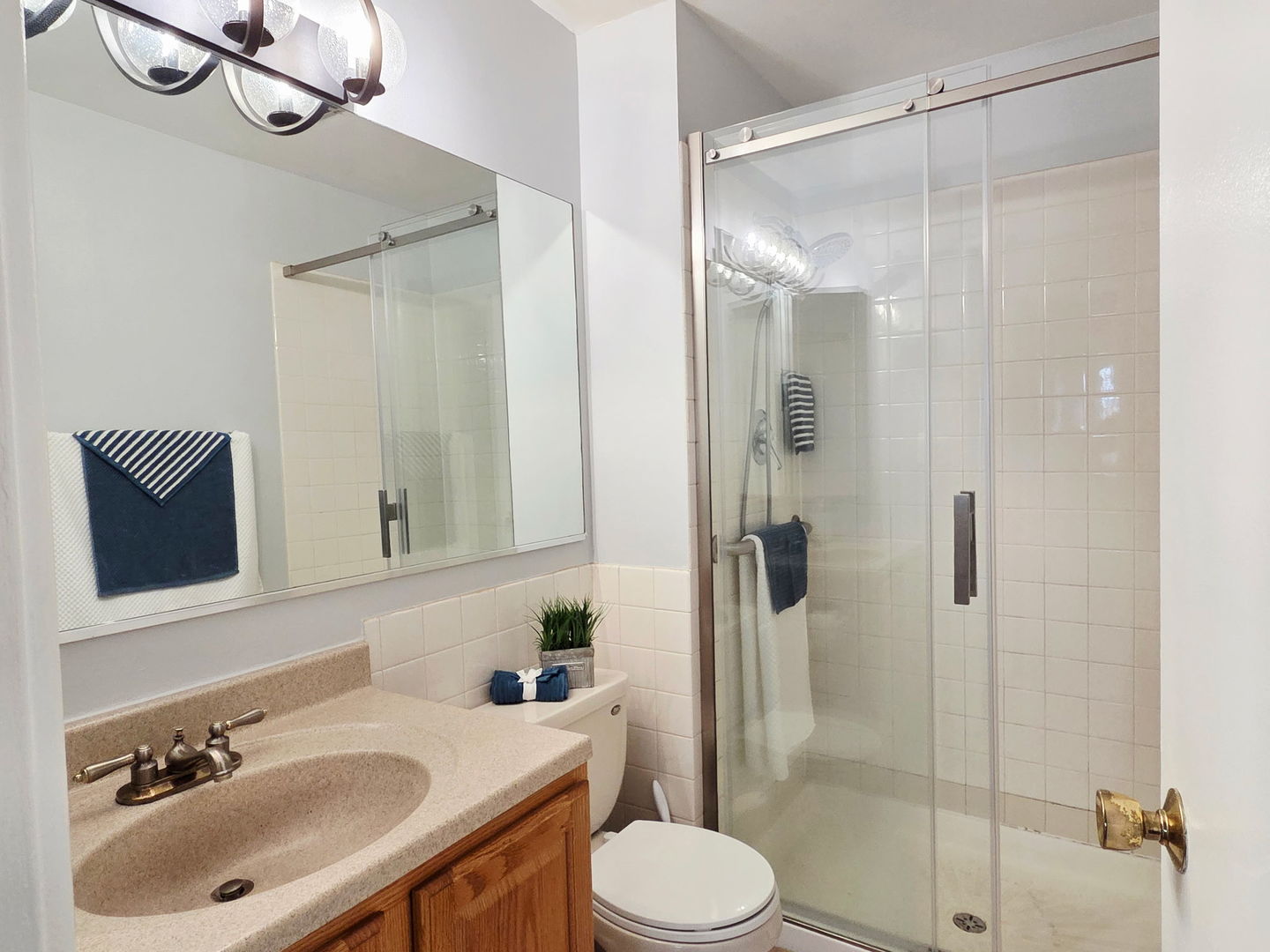 1217 South Old Wilke Road, Unit 201 Rolling Meadows, IL 60005 - Photo 11 of 26 a bathroom with a sink toilet and shower